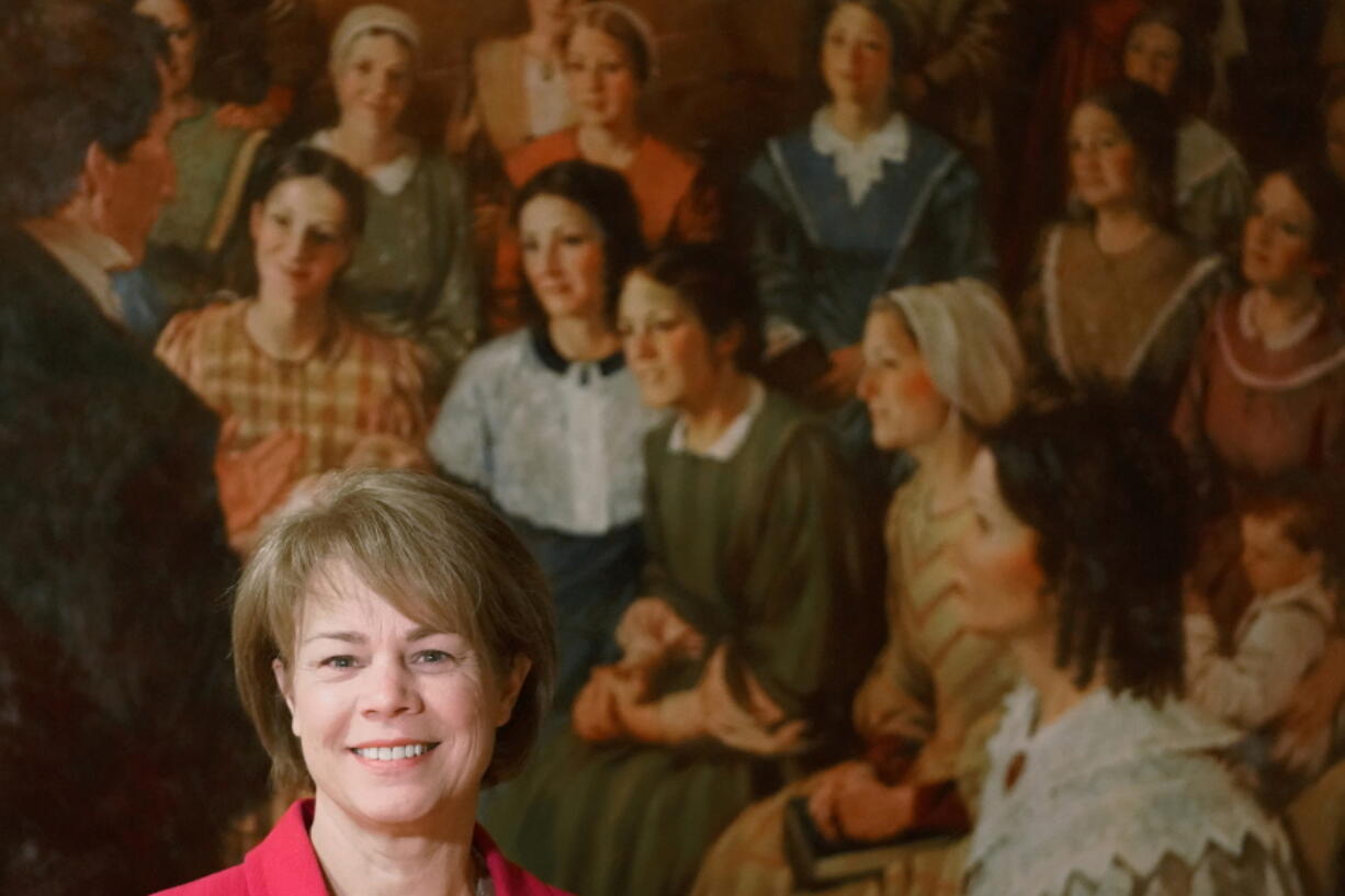 Sharon Eubank, first counselor in the general presidency of the Relief Society, which is made up of all adult women in The Church of Jesus Christ of Latter-day Saints, poses for a photograph Tuesday, Dec. 7, 2021, in Salt Lake City. When she was younger, Eubank figured she would one day marry and form the kind of nuclear family typically expected of members of The Church of Jesus Christ of Latter-day Saints. Today, at 58, she is neither married nor a mother but glad to embody a different image of womanhood as one of the top female leaders in the male-dominated faith widely known as the Mormon church.