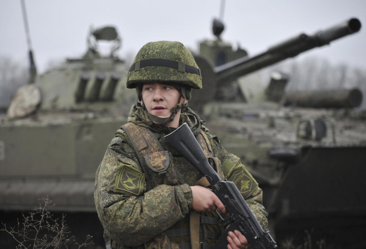 A Russian army soldier takes part in drills at the Kadamovskiy firing range in the Rostov region in southern Russia, Friday, Dec. 10, 2021. Russian troop concentration near Ukraine has raised Ukrainian and Western concerns of a possible invasion that Moscow has dismissed.