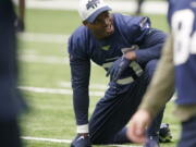 Running back Adrian Peterson, who was signed to the Seattle Seahawks practice squad on Wednesday, stretches Thursday, Dec. 2, 2021, before NFL football practice in Renton, Wash. (AP Photo/Ted S.