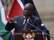 South African President Cyril Ramaphosa addresses the media after meeting with his Kenyan counterpart Uhuru Kenyatta in Pretoria, South Africa, Tuesday Nov. 23, 2021 . Kenyatta is in South Africa on a state visit to discuss political and economic issues.