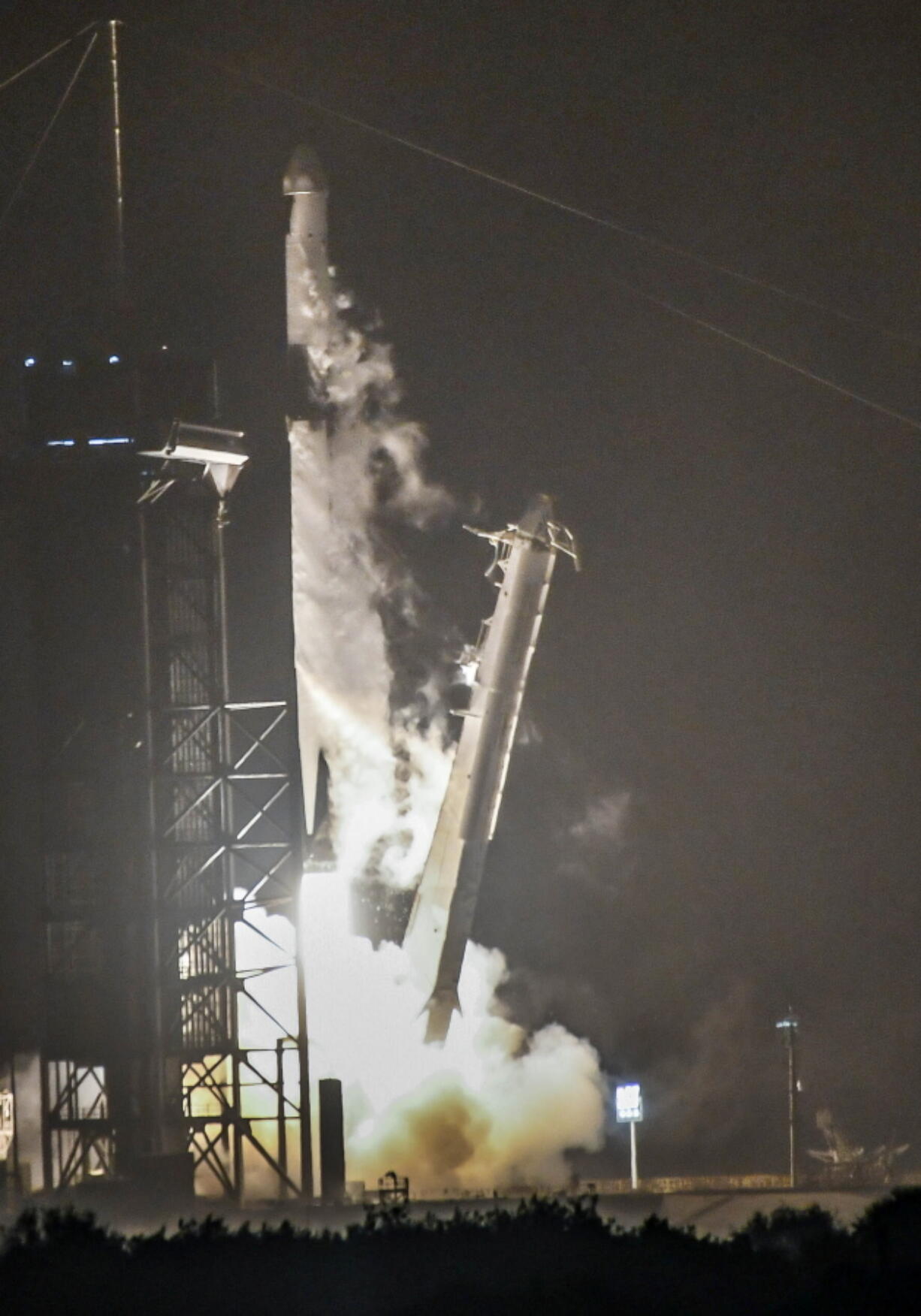 A SpaceX Falcon 9 rocket lifts off from Kennedy Space Center, Fla., Tuesday morning, Dec. 21, 2021. The rocket is carrying supplies for the International Space Station.