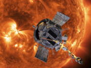 FILE - This image made available by NASA shows an artist's rendering of the Parker Solar Probe approaching the Sun. On Tuesday, Dec. 14, 2021, NASA announced that the spacecraft has plunged through the unexplored solar atmosphere known as the corona in April, and will keep drawing ever closer to the sun and diving deeper into the corona.