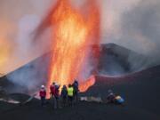 Scientists from CSIC, or the Spanish National Research Council, take geophysics measurements on the Canary Island of La Palma, Spain, on Nov. 18.