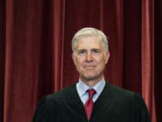 FILE - Associate Justice Neil Gorsuch stands during a group photo at the Supreme Court in Washington, April 23, 2021.