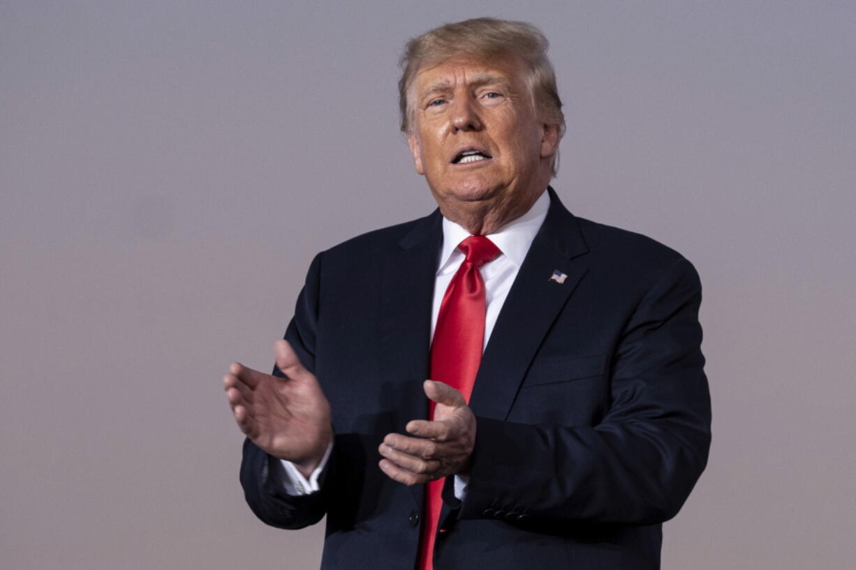 FILE -- Former President Donald Trump prepares to take the stage during his Save America rally in Perry, Ga., Sept. 25, 2021. New York Attorney General Letitia James is seeking former President Trump's testimony in an ongoing investigation into his business practices, a person familiar with the matter said, Thursday, Dec. 9, 2021.