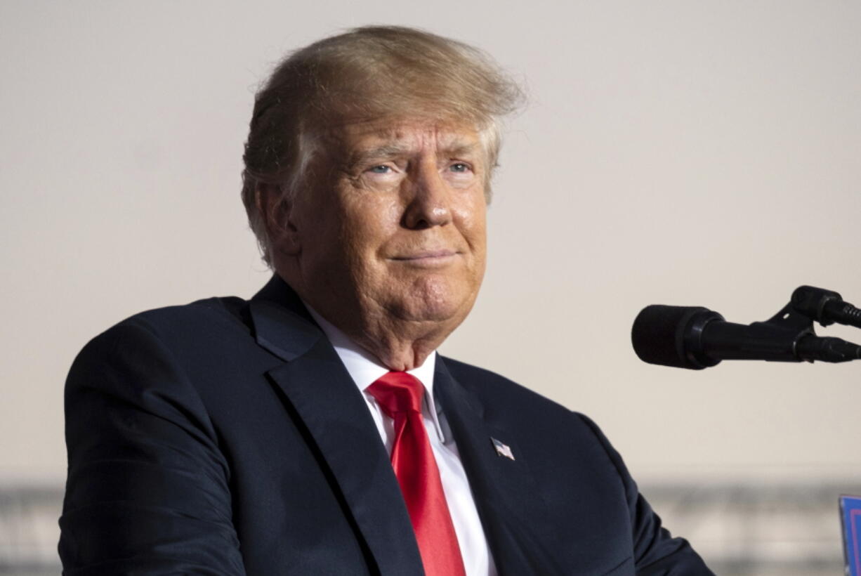 FILE - Former President Donald Trump speaks during a rally in Perry, Ga., on Sept. 25, 2021. The editor of Forbes magazine testified Thursday, Dec. 16, 2021, before a grand jury hearing evidence in a criminal investigation of former President Donald Trump and his business practices, answering questions about an article examining whether the former president inflated his wealth.