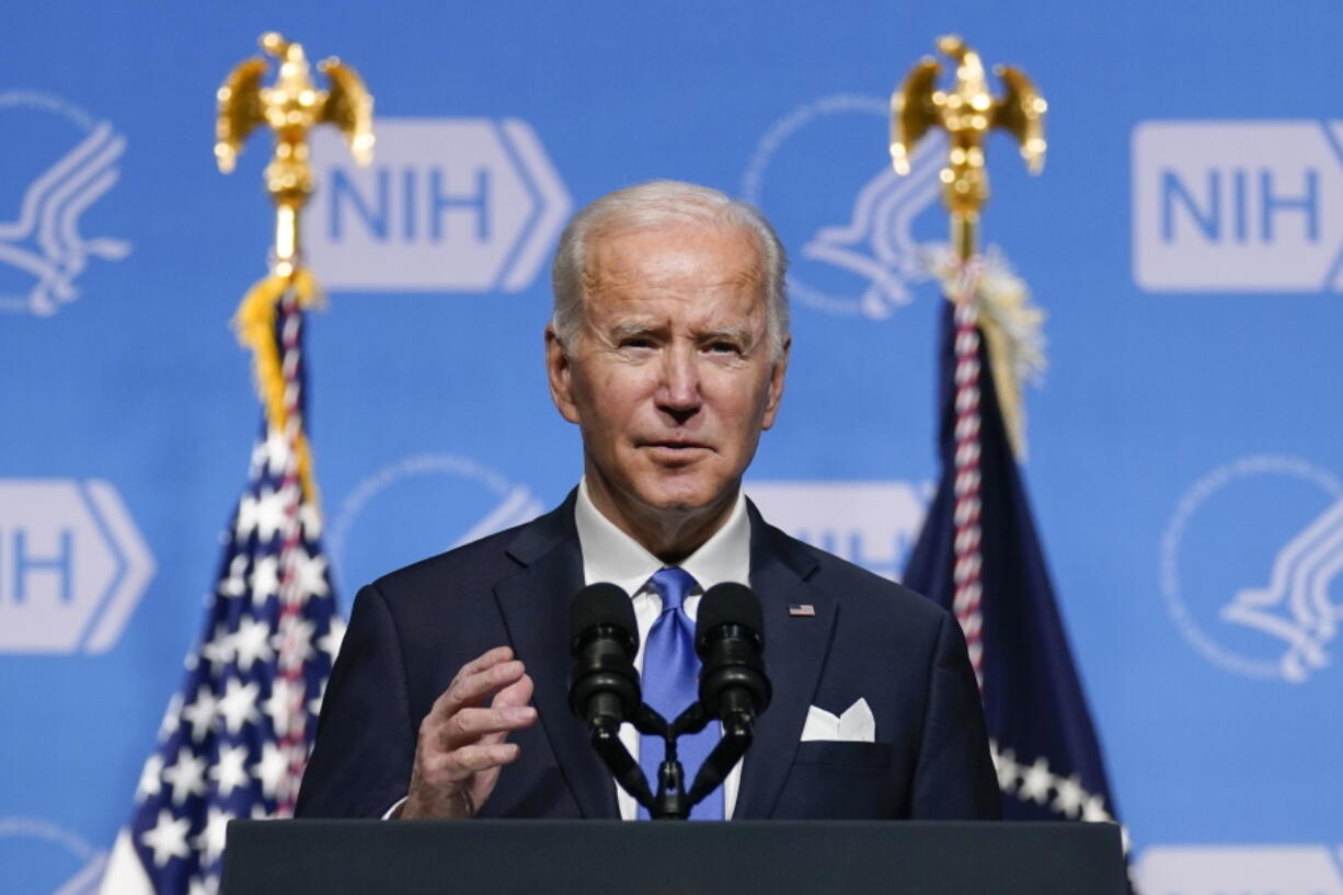 FILE - President Joe Biden speaks about the COVID-19 variant named omicron during a visit to the National Institutes of Health on Dec. 2, 2021, in Bethesda, Md. Biden plans to stress in a Dec. 21 speech the importance of getting vaccinated to protect from a wave of COVID-19 infections tied to the new omicron variant as Christmas approaches.