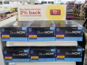 FILE - Boxes of BinaxNow home COVID-19 tests made by Abbott are shown for sale on Nov. 15, 2021, at a CVS store in Lakewood, Wash. The Biden administration's plan for health insurers to reimburse consumers for over-the-counter COVID-19 tests is recalling the model of a bygone era when the companies processed large volumes of claims from individuals -- with paper receipts. (AP Photo/Ted S.