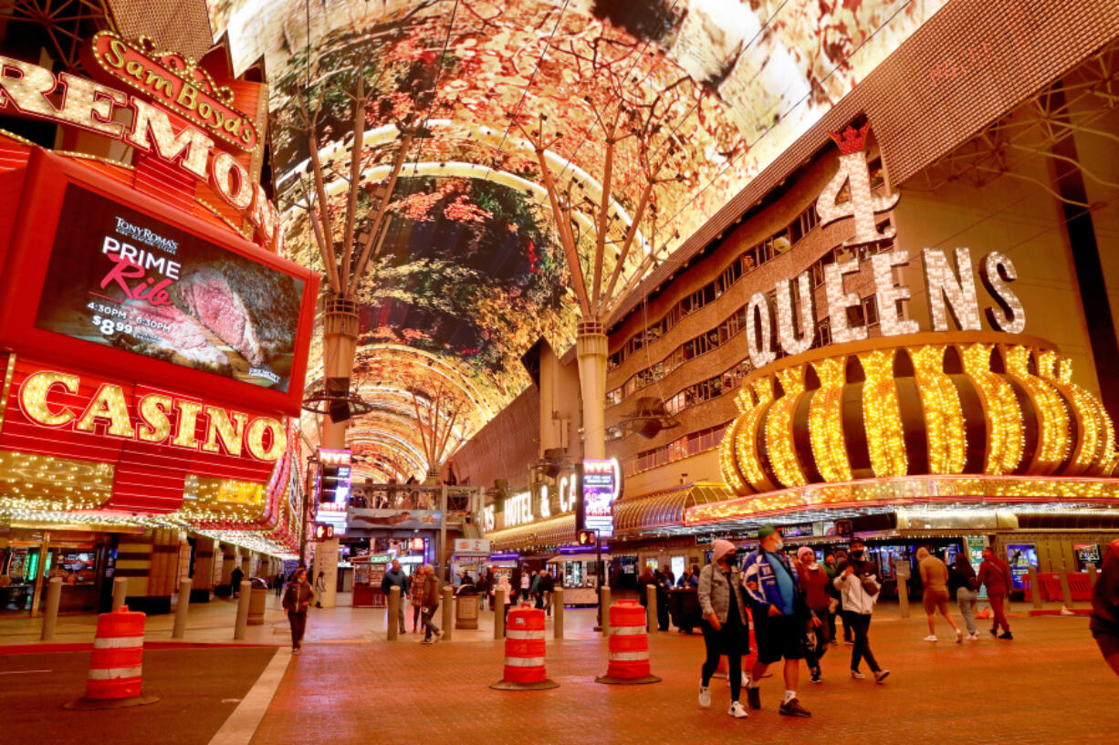 Fremont Hotel & Casino, left, and Four Queens Resort and Casino along Fremont. Street in downtown Las Vegas on Wednesday, Dec. 15, 2021.