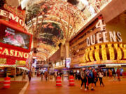 Fremont Hotel & Casino, left, and Four Queens Resort and Casino along Fremont. Street in downtown Las Vegas on Wednesday, Dec. 15, 2021.