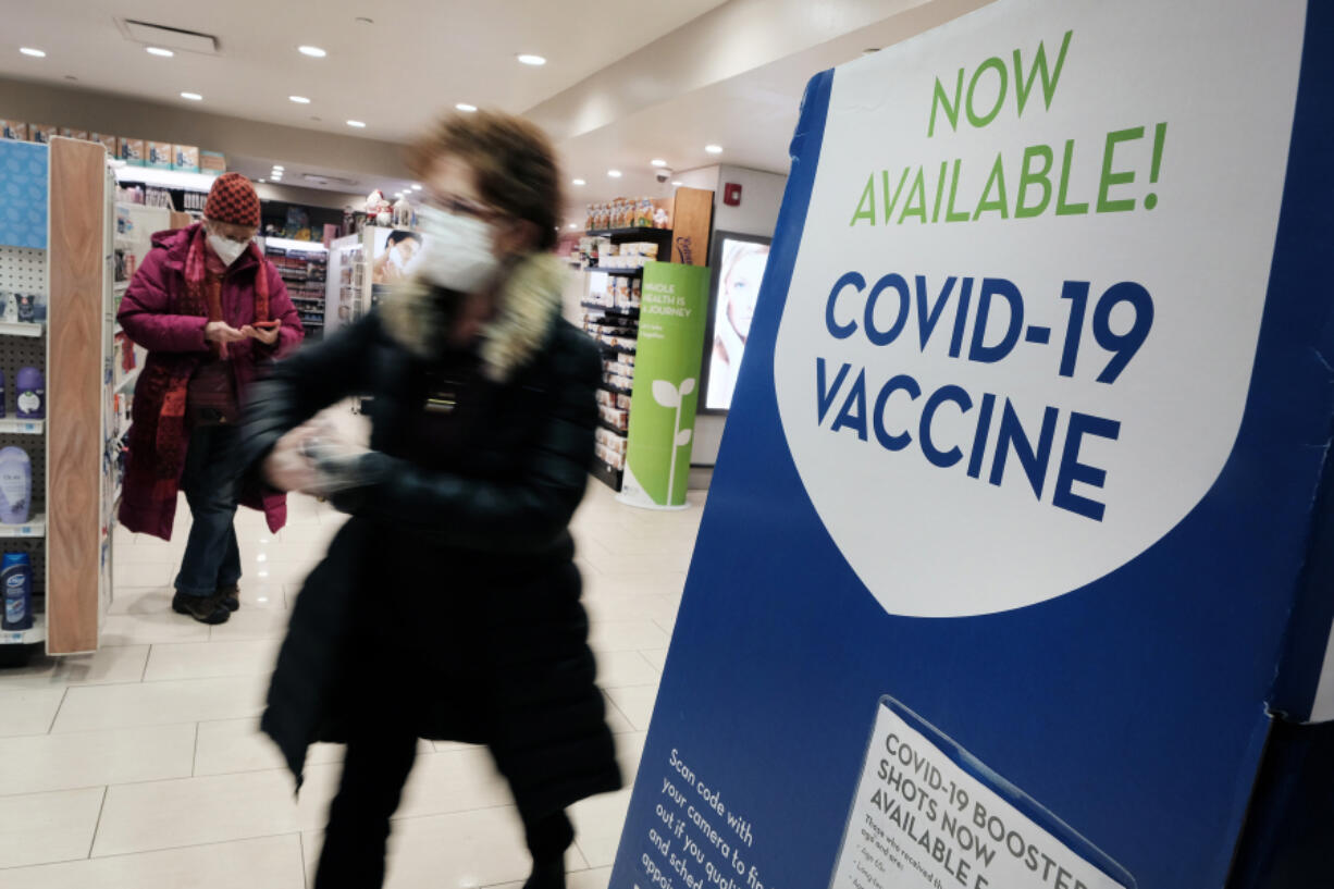 A pharmacy in Grand Central Terminal advertises the COVID-19 vaccine on Thursday, Dec. 9, 2021 in New York City.