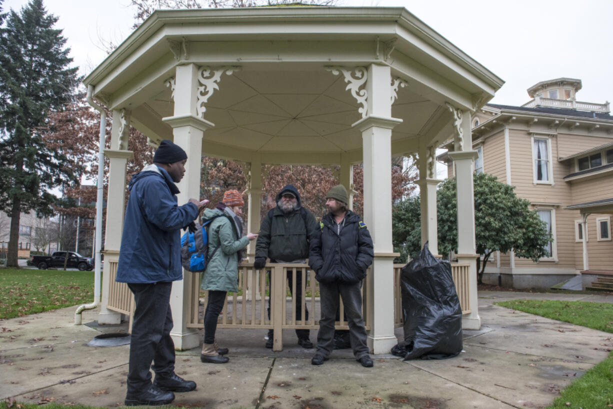 From left: Willie Hurst and Katelyn Benhoff, outreach case managers with Share, speak with Mitch and Patrick S., who declined to provide their last names, on Jan. 24, 2019, while performing the annual Point in Time count, a census of the homeless population.