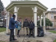 From left: Willie Hurst and Katelyn Benhoff, outreach case managers with Share, speak with Mitch and Patrick S., who declined to provide their last names, on Jan. 24, 2019, while performing the annual Point in Time count, a census of the homeless population.