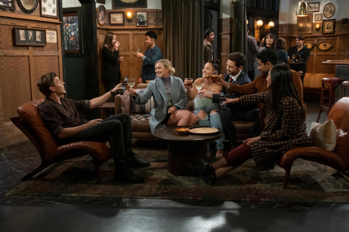 Chris Lowell, from left, Hilary Duff, Francia Raisa, Tom Ainsley, Suraj Sharma and Tien Tran in "How I Met Your Father." (Patrick Wymore/Hulu)