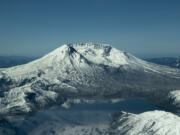 Spirit Lake sits at the foot of Mount St. Helens in this aerial photo from 2021. A coalition of local and federal officials are working to forge an agreement for the future of Spirit Lake, the Cowlitz River and other waterways still affected by the aftermath of the 1980 Mount St. Helens eruption.