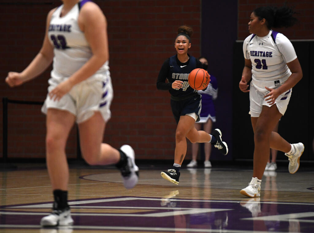 Skyview junior Jordan Labrador-Hallett, center, directs the team Tuesday, Jan. 4, 2022, during the Storm’s 66-40 win against the Timberwolves at Heritage High School.