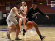 Skyview junior Jordan Labrador-Hallett, right, steals the ball from Heritage’s Sarah Bautista on Tuesday, Jan. 4, 2022, during the Storm’s 66-40 win against the Timberwolves at Heritage High School.