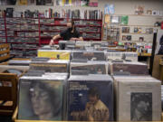 Vinyl is a fully immersive experience, says Joel Mulligan, owner of Everybody's Music in downtown Vancouver.  Modern-era vinyl sales records were broken over the holiday. At top, "Fearless (Taylor's Version)" by Taylor Swift is among the vinyl records for sale at Everybody's Music.