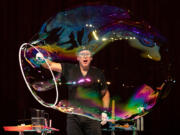 Louis Pearl, who's stage name is The Amazing Bubble Man, performs for the audience as part of Columbia Play Project's Wiggles and Giggles series at Kiggins Theatre on Saturday. The next performance in the Wiggles and Giggles series will feature Hearts and Hands Drumming on Feb. 12 at Kiggins Theatre.