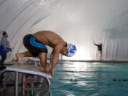 Mountain View High School junior Griffin Barlow, shown here during a recent swim practice at Cascade Athletic Club, was born with achondroplasia, the most common form of dwarfism. At 4 feet tall, the swimming pool is where Barlow finds success and self-confidence. "You don't hear that a lot," he said.