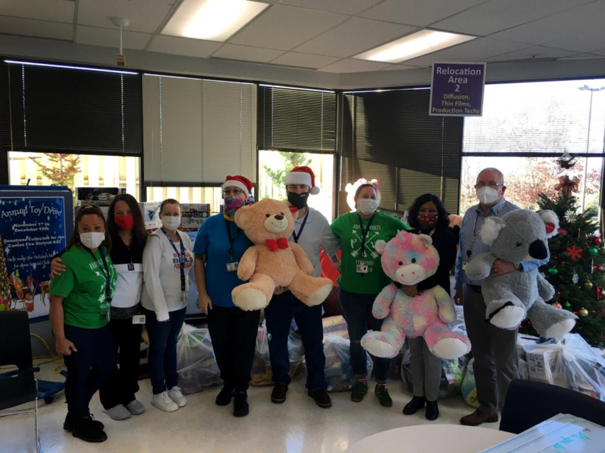 Analog Devices' Community Outreach Committee oversees the collecting and delivering of Christmas for families in need in the Camas and Washougal school districts.