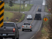 Motorists navigate the four-way stop at the intersection of Northeast 179th Street and Northeast 29th Avenue on Wednesday morning.