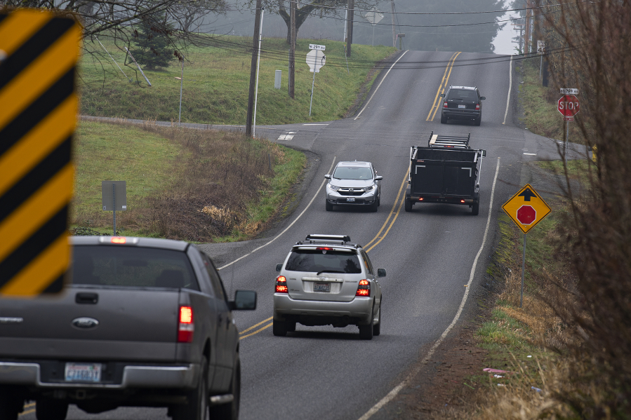 Motorists navigate the four-way stop at the intersection of Northeast 179th Street and Northeast 29th Avenue on Wednesday morning.