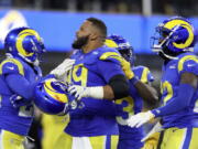 Los Angeles Rams defensive end Aaron Donald, middle, celebrates with teammates during the second half of the NFC Championship NFL football game against the San Francisco 49ers Sunday, Jan. 30, 2022, in Inglewood, Calif.