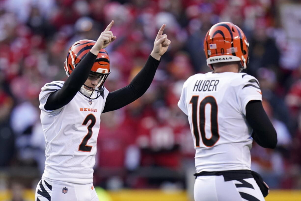 Cincinnati Bengals kicker Evan McPherson (2) celebrates with Kevin Huber (10) after kicking a 52-yard field goal during the second half of the AFC championship NFL football game against the Kansas City Chiefs, Sunday, Jan. 30, 2022, in Kansas City, Mo.