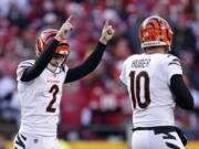 Cincinnati Bengals kicker Evan McPherson (2) celebrates with Kevin Huber (10) after kicking a 52-yard field goal during the second half of the AFC championship NFL football game against the Kansas City Chiefs, Sunday, Jan. 30, 2022, in Kansas City, Mo.