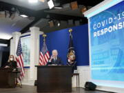 President Joe Biden, accompanied by FEMA administrator Deanne Criswell, speaks about the government's COVID-19 response, in the South Court Auditorium in the Eisenhower Executive Office Building on the White House Campus in Washington, Thursday, Jan. 13, 2022.