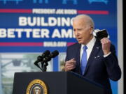 President Joe Biden begins to speak Friday about the Bipartisan Infrastructure Law at the South Court Auditorium in the Eisenhower Executive Office Building on the White House Campus in Washington.