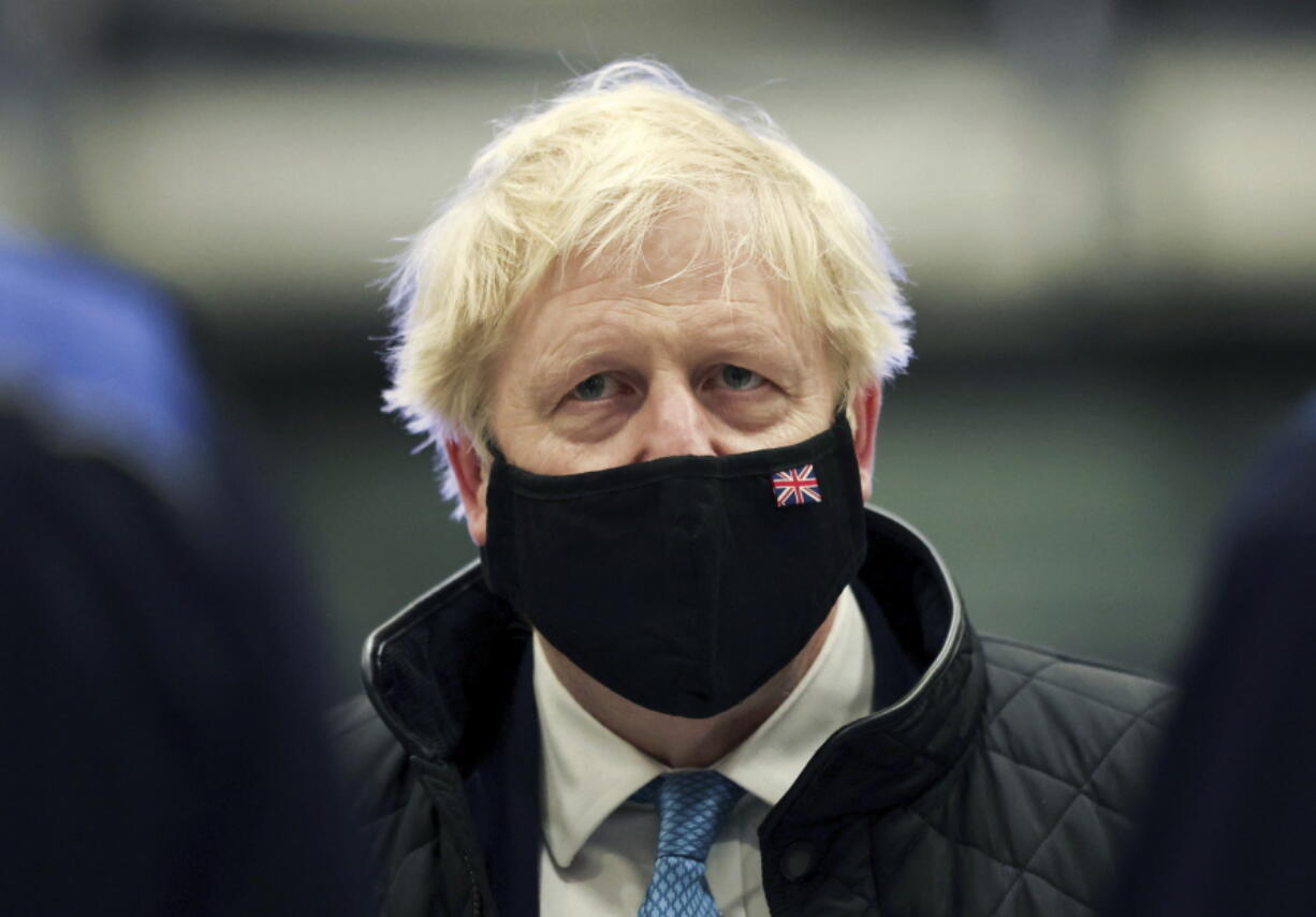 Britain's Prime Minister Boris Johnson looks on, during a visit to RAF Valley, in Anglesey, North Wales, Thursday, Jan. 27, 2022.