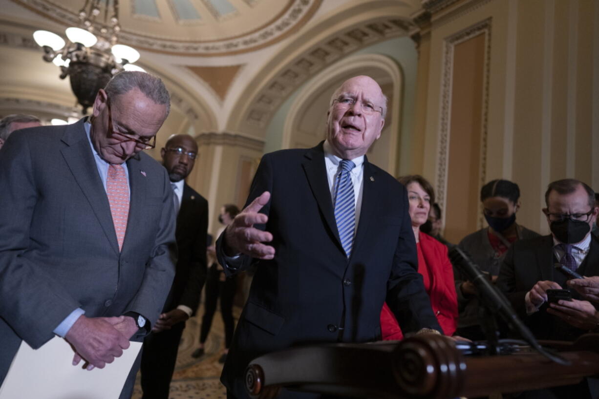 FILE - From left, Senate Majority Leader Chuck Schumer, D-N.Y., Sen. Raphael Warnock, D-Ga., Sen. Patrick Leahy, D-Vt., chair of the Senate Appropriations Committee, and Sen. Amy Klobuchar, D-Minn., chair of the Senate Rules Committee, talk about the need for the John Lewis Voting Rights Advancement Act, as they speak to reporters following a Democratic policy meeting at the Capitol in Washington, Nov. 2, 2021. Democrats are mounting an impassioned push to overhaul Senate rules that stand in the way of their sweeping elections legislation, arguing dark forces unleashed by Donald Trump's "big lie" about the 2020 presidential contest pose such a grave threat to democracy that they demand a forceful response. (AP Photo/J.