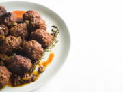 This image released by Milk Street shows a recipe for Spanish Meatballs.