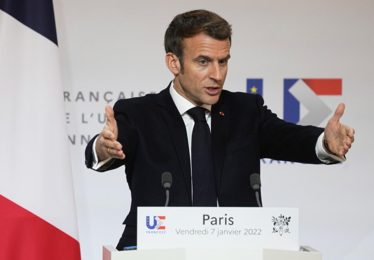 French President Emmanuel Macron speaks as he participates in a media conference with European Commission President Ursula von der Leyen after a meeting at the Elysee Palace in Paris, France, Friday, Jan. 7, 2022.