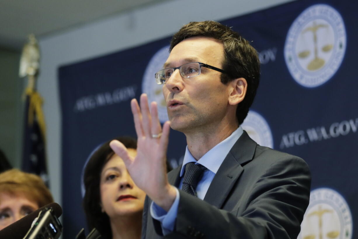 FILE - Washington Attorney General Bob Ferguson talks to reporters, Monday, Aug. 26, 2019, during a news conference in Seattle. In a 5-4 decision Thursday, Jan. 20, 2022, the Washington Supreme Court upheld an $18 million campaign finance penalty against the Consumer Brands Association, formerly known as the Grocery Manufacturers Association. Ferguson sued the group in 2013, alleging that it spent $11 million to oppose a ballot initiative without registering as a political committee or disclosing the source of the money. (AP Photo/Ted S.