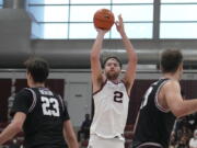 Gonzaga forward Drew Timme (2) takes a 3-point shot between Santa Clara forward Parker Braun (23) and forward Josip Vrankic, right, during the second half of an NCAA college basketball game Saturday, Jan. 15, 2022, in Santa Clara, Calif.