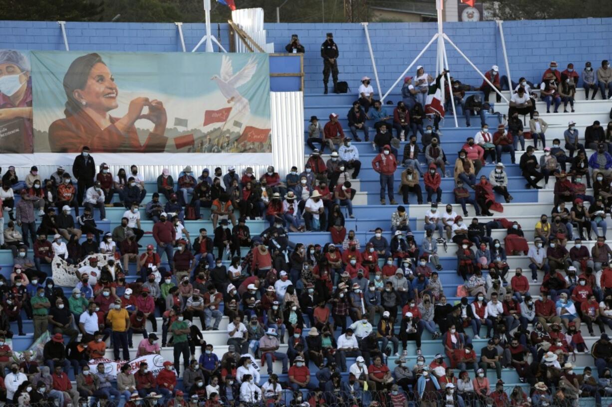 People wait in the National Stadium for the inauguration of President-elect Xiomara Castro, the first female president in Tegucigalpa, Honduras, Thursday, Nov. 27, 2022.