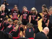 The Camas girls basketball team huddles during a timeout en route to a 60-42 win over Skyview on Friday at Skyview High School.