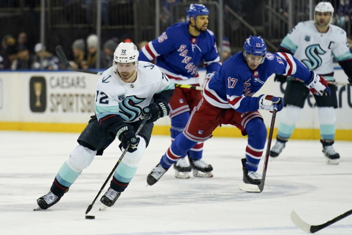 Seattle Kraken right wing Joonas Donskoi (72) skates the puck up the ice during the first period of an NHL hockey game against the New York Rangers, Sunday, Jan. 30, 2022, in New York.