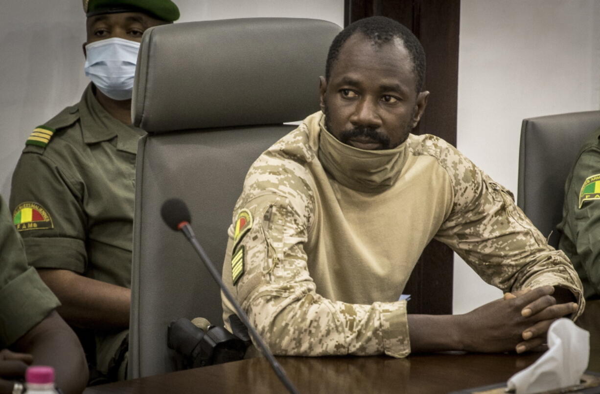 FILE - Col. Assimi Goita meets with a high-level delegation from the West African regional bloc known as ECOWAS, at the Ministry of Defense in Bamako, Mali, Aug. 22, 2020. West African regional leaders signaled Sunday Jan. 9, 2022 at a special meeting in Ghana's capital that they will oppose an effort by the Mali's coup leader to extend his time in power by four more years instead of holding democratic elections next month as originally promised.