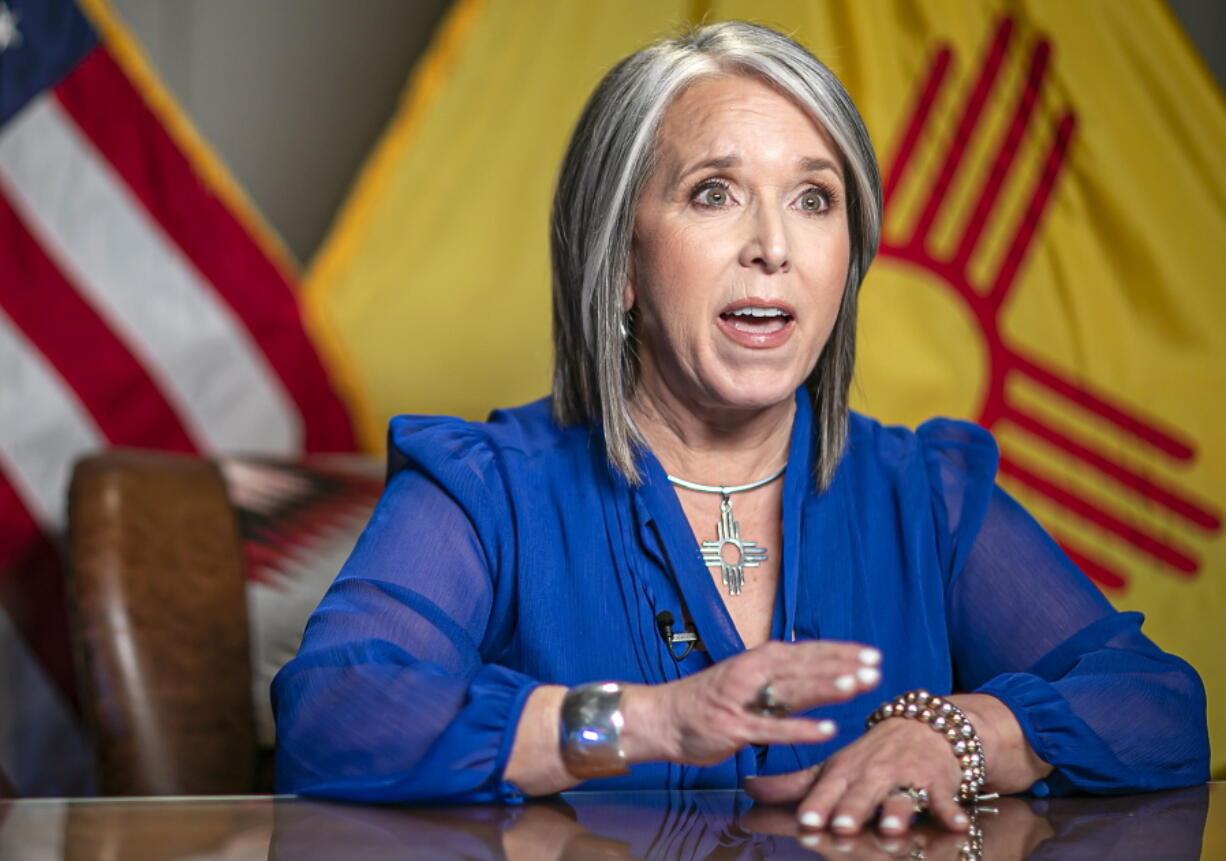 New Mexico Gov. Michelle Lujan Grisham delivers the State of the State address during the 56th legislative session Tuesday, Jan. 18, 2022, in Santa Fe, N.M. Her State of the State address was delivered live but remote from her office as lawmakers gathered in their chambers at the state capitol.