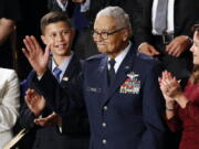 FILE - Tuskegee airman Charles McGee and his great grandson Iain Lanphier react as President Donald Trump delivers his State of the Union address to a joint session of Congress on Capitol Hill in Washington, Tuesday, Feb. 4, 2020. McGee, one of the last surviving Tuskegee Airmen who flew 409 fighter combat missions over three wars, died Sunday, Jan. 16, 2022. He was 102.