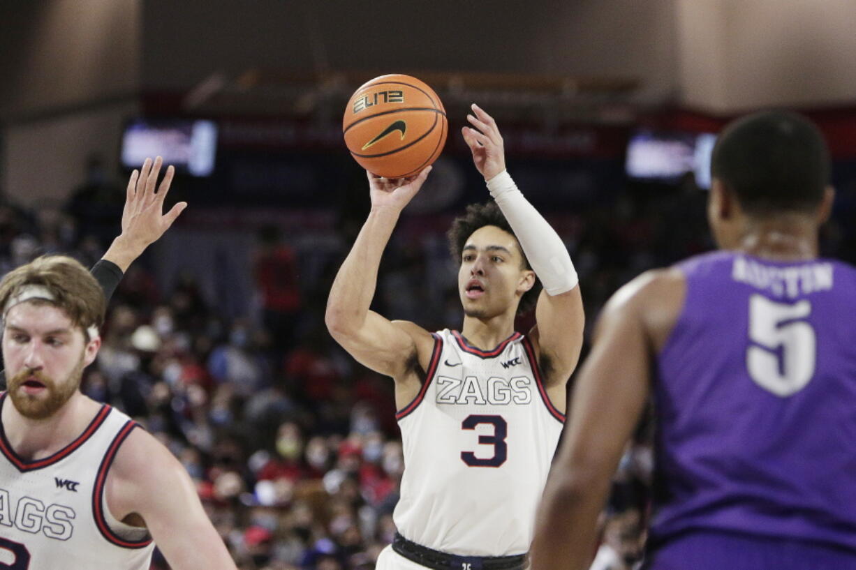 Gonzaga guard Andrew Nembhard (3) shoots during the first half of an NCAA college basketball game against Portland, Saturday, Jan. 29, 2022, in Spokane, Wash.