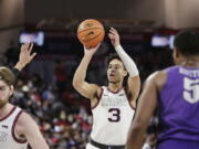 Gonzaga guard Andrew Nembhard (3) shoots during the first half of an NCAA college basketball game against Portland, Saturday, Jan. 29, 2022, in Spokane, Wash.