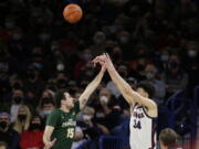 Gonzaga center Chet Holmgren (34) shoots over San Francisco guard Gabe Stefanini (15) during the first half of an NCAA college basketball game, Thursday, Jan. 20, 2022, in Spokane, Wash.