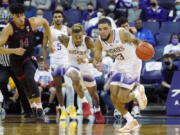 Washington guard Terrell Brown Jr. (23) breaks away after a turnover as Stanford forward Spencer Jones (14) looks on during the first half of an NCAA college basketball game, Saturday, Jan. 15, 2022, in Seattle. (AP Photo/Ted S.