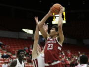 Stanford forward Brandon Angel, right, shoots over Washington State forward Andrej Jakimovski during the first half of an NCAA college basketball game, Thursday, Jan. 13, 2022, in Pullman, Wash.