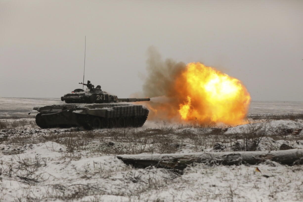 A Russian tank T-72B3 fires as troops take part in drills at the Kadamovskiy firing range in the Rostov region in southern Russia, on Jan. 12, 2022.